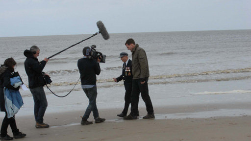 Dan with veteran on the beach